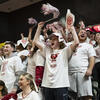 students cheering at a Temple basketball game.